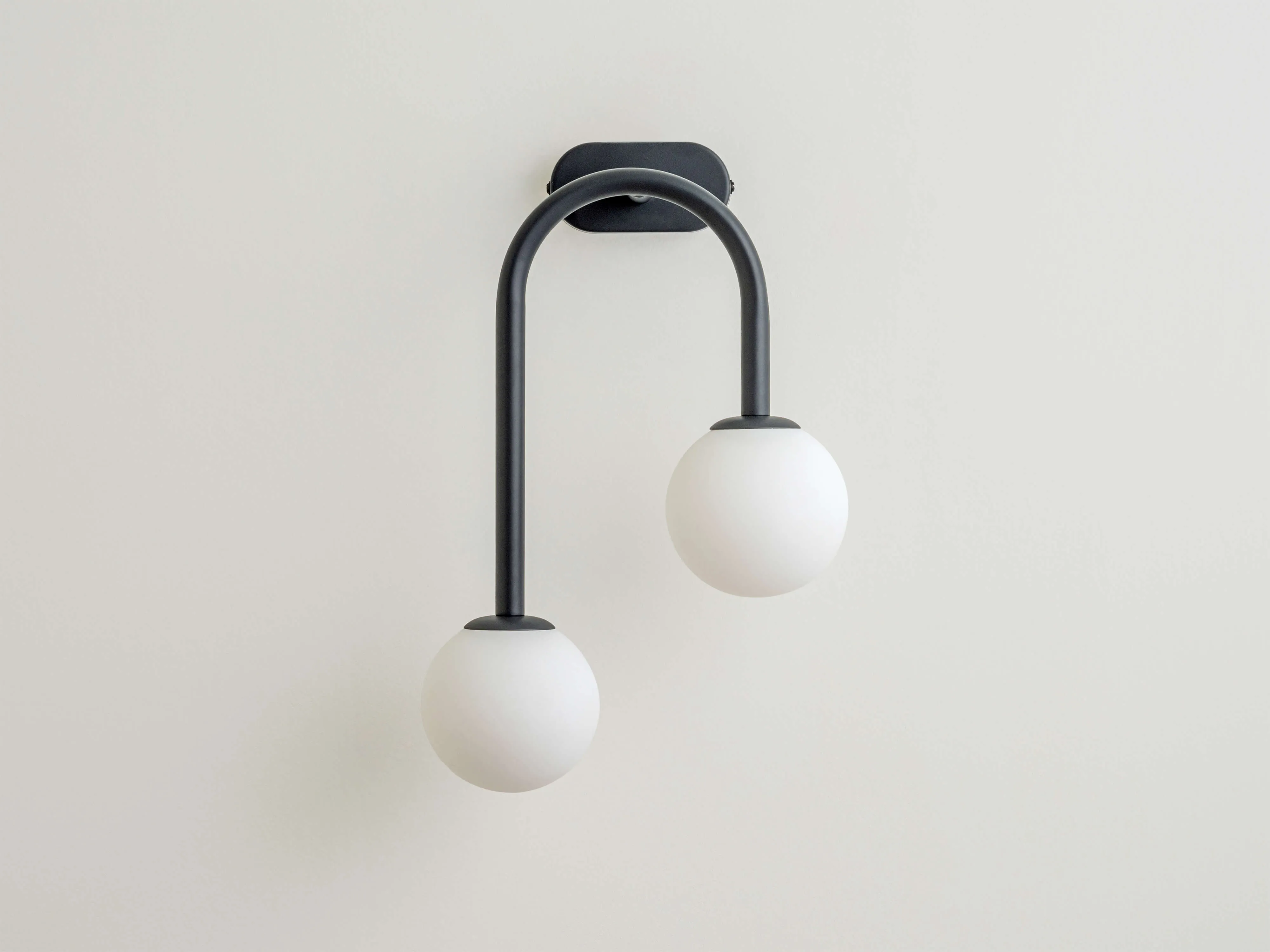 Charcoal grey drop curve wall light