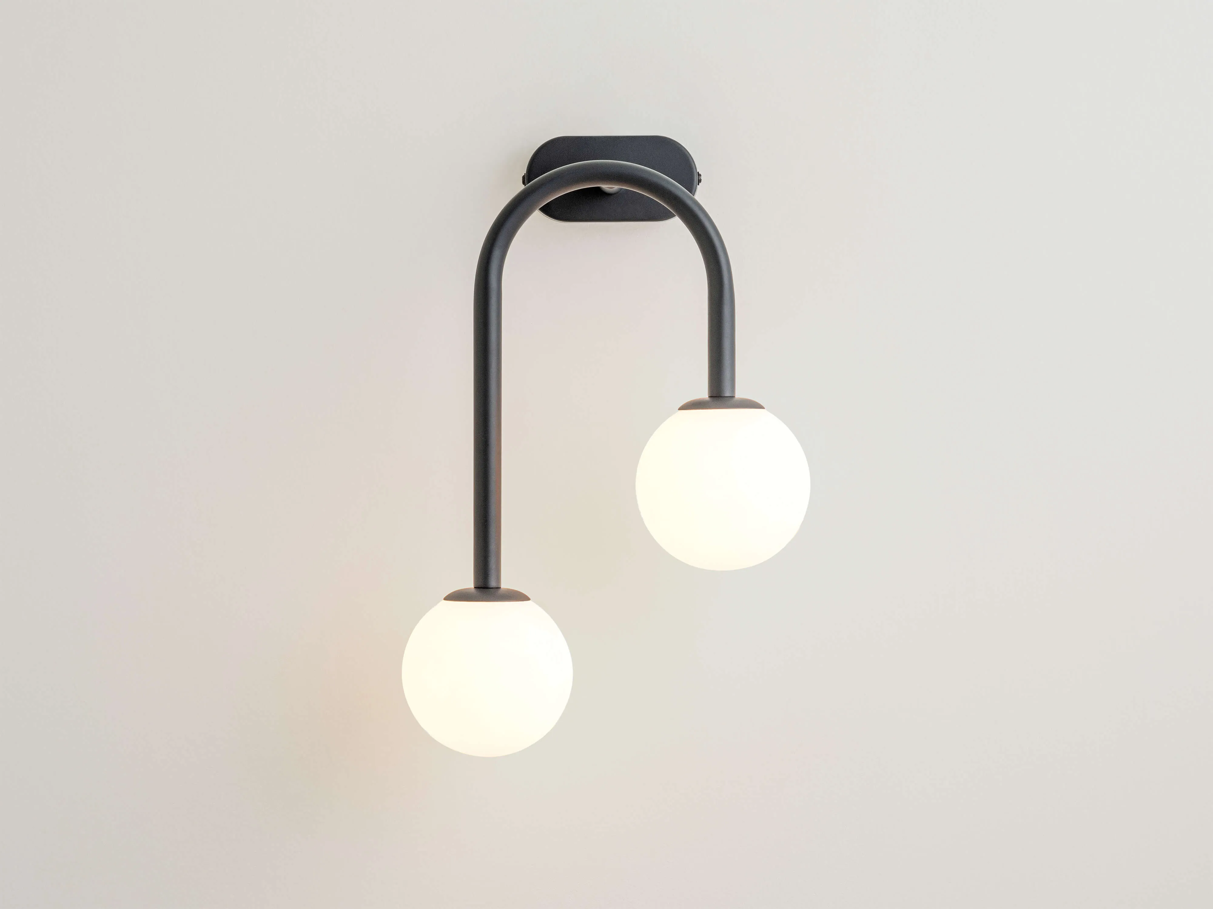 Charcoal grey drop curve wall light